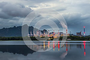 Industrial power plant with smokestack near the river