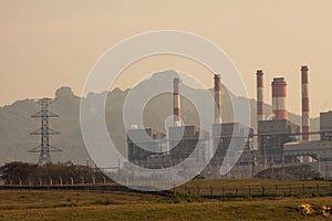 Industrial power plant with smokestack, the power plant production on hot condition in the mountain