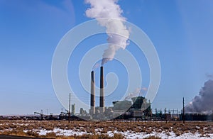 Industrial power plant with smokestack