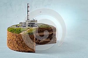 Industrial power plant with smokestack on top of the cake