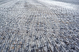 Top view of scarified and grooved concrete on a city road for overlay prep photo