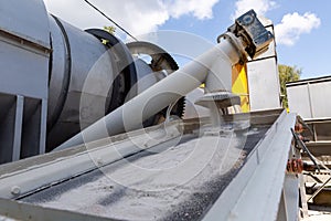 Industrial production of construction mixtures. Tower silos with bulk ingredients. Line for drying and sorting of sand