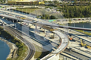 Industrial roadworks in Miami, Florida. Wide american highway junction under construction. Development of interstate