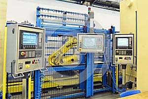 Industrial robot with control unit in a factory for mechanical e