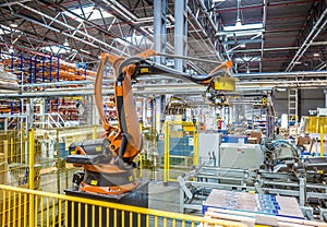 Industrial robot packer in the workshop production