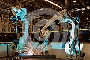 Industrial robot are test run new program in automotive assembly