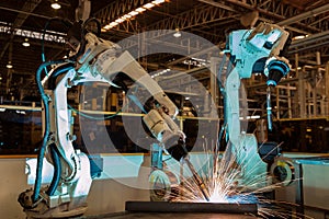 Industrial robot are test run new program in automotive factory