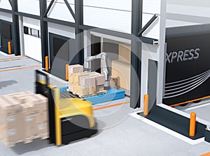 Industrial robot unloading parcels from semi truck