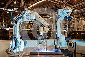 Industrial robot is welding assembly steel part in car factory