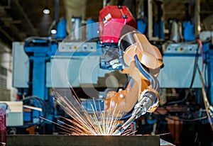 Industrial robot is welding part in automotive industrial factory