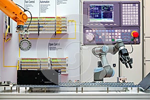 Industrial robotics automation working via conveyor belt on smart factory,