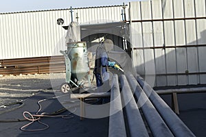 Industrial Sand Blasting works for the pipes in the site. steel pipes for fire fighting system and extinguishing water lines.