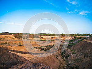 Industrial sand quarry with hydraulic excavator machinery for construction. industrial landscape, construction industry