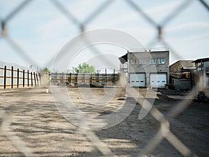 Industrial scene seen through a fence, in East Williamsburg, Brooklyn, New York City photo