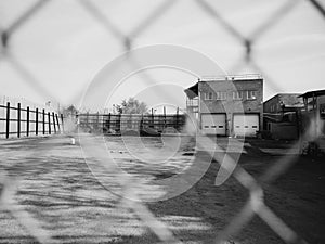 Industrial scene seen through a fence, in East Williamsburg, Brooklyn, New York City photo