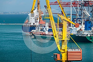 Industrial seaport infrastructure, sea, crane and ship, concept of sea cargo transportation