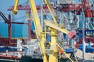 Industrial seaport infrastructure, sea, ship and cranes, concept of sea cargo transportation