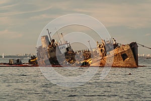 Industrial ship crane lifts old sunken tanker Delfi from Black Sea in Odessa, Ukraine 26 August 2020. Ship crashed near shore sea