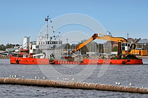 Industrial ship on dredging works photo