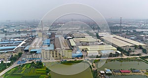 Industrial shops on the river bank, China. Plant on the river bank