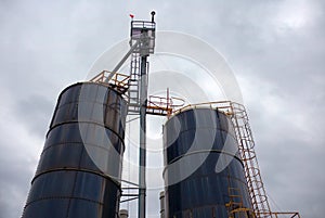 Industrial silo storage factory building container cloudy sky