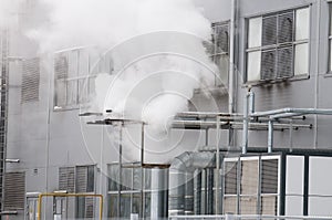 Industrial smoke from the pipe in the factory. photo