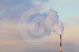 Industrial Smoke Pipe on a sunny and cloudy sky photo