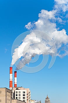 Industrial smoke stack of coal power plant in city