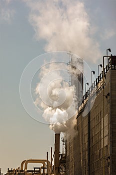 Industrial smoke stack emitting steam