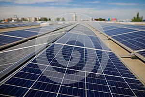 Industrial solar panels on the roof of a hypermarket photo