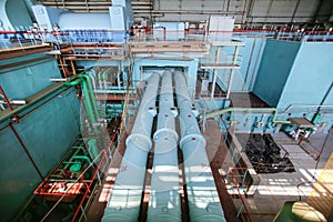 Industrial steam pipelines at power generator hall at nuclear power plant