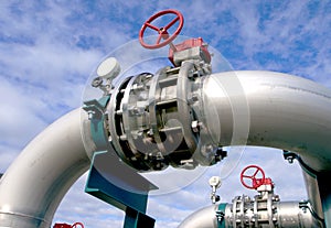 Industrial Steel pipelines and valves against blue sky