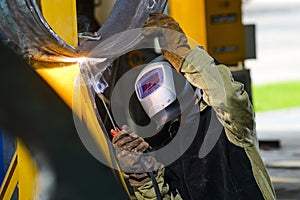 Industrial steel welder in factory