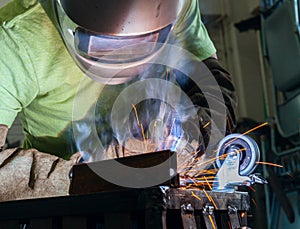 Industrial steel welder in factory working