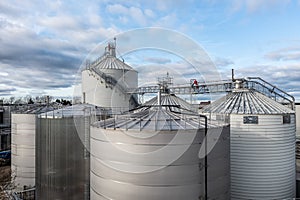 Industrial storage or silo tanks in a row with copy space above