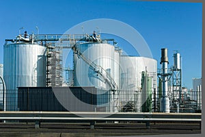 Industrial storage tanks and blue sky