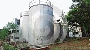 Industrial storage tanks at soap manufacturing factory