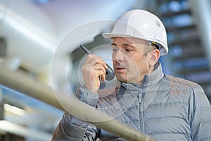 industrial technician talking in walkietalkie