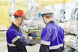 industrial technicians works at power energy supply factory