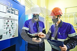 industrial technicians works at power energy supply factory