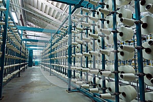 Industrial textile factory. Coils with threads in production.Fabric production .