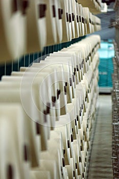 Industrial textile factory. Coils with threads in production.Fabric production .