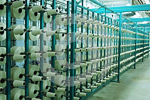 Industrial textile factory. Coils with threads in production.Fabric production .