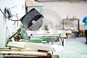 Industrial tool in wood and metal factory, compound mitre saw photo