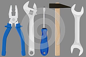 Industrial tools kit - pliers, adjustable wrench, screwdriver, hammer, spanner.