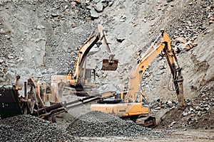 Industrial track type excavator working on highway construction site, heavy duty machinery activity