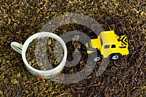 Industrial tractor toy load green tea leafs to cup