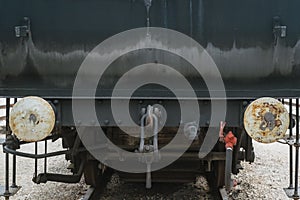 Industrial or transportation or steam punk vintage background with detail of old rusty steam locomotive