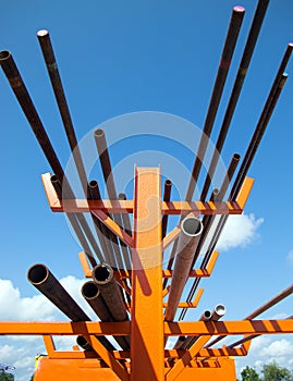 Industrial tubular pipes on storage rack photo