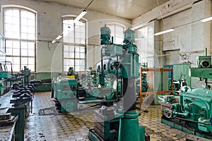 Industrial turning and drilling machine tools in old workshop